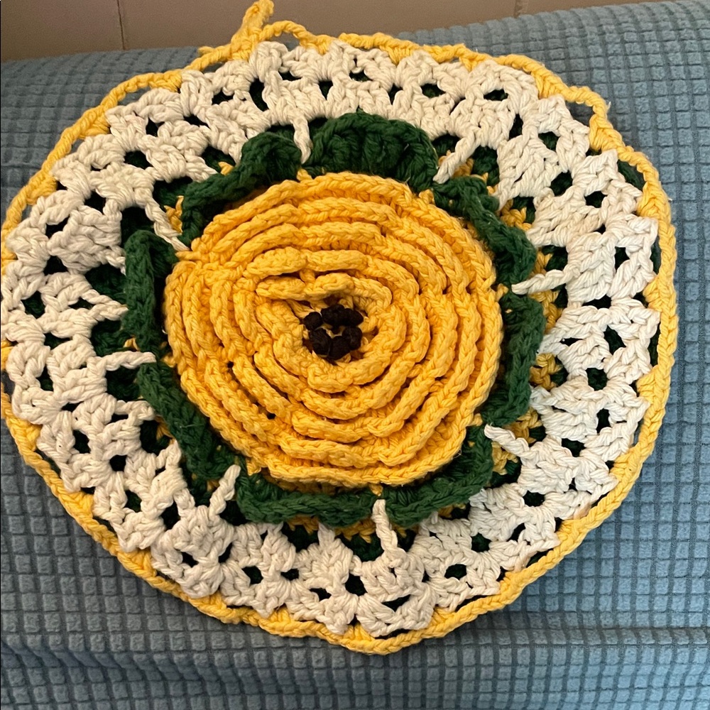 Hand crocheted green/yellow/white flower trivet